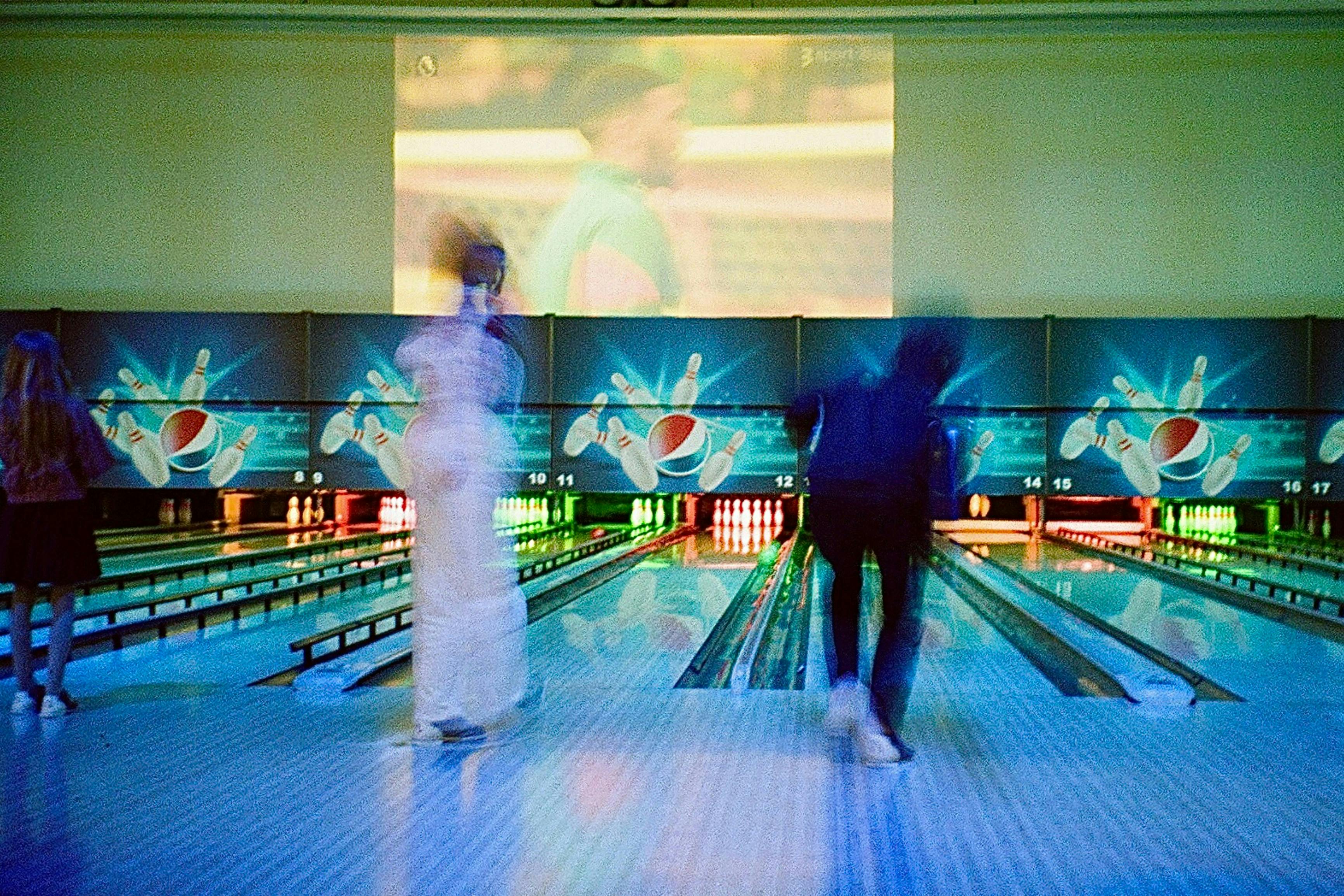 a group of people playing bowling